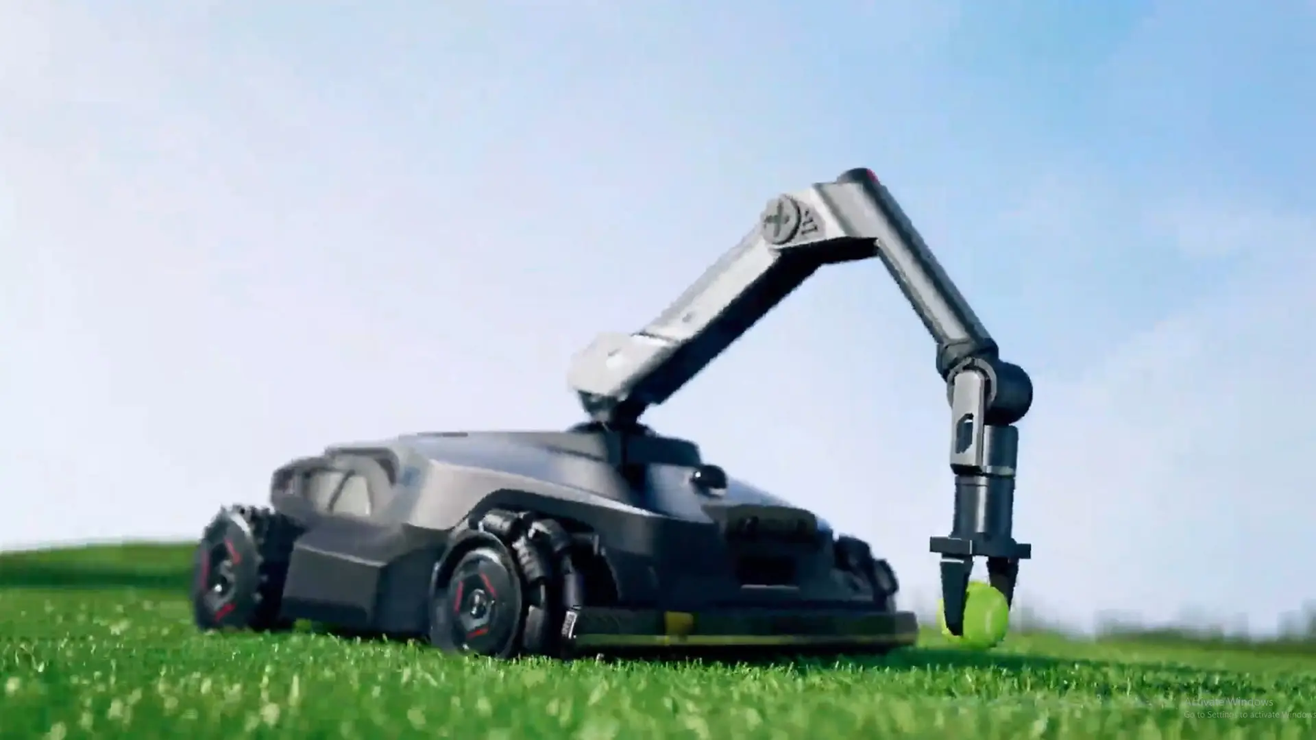 This Crazy Robot Lawn Mower Has a Robo Arm